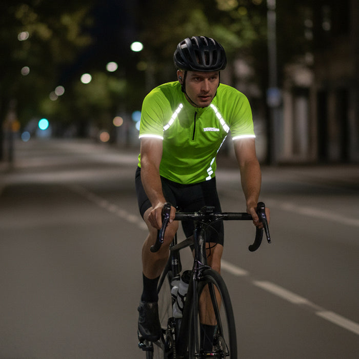 Cyclist in a fluorescent reflective cycling jersey