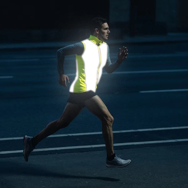 Runner wearing a reflective yellow vest at night
