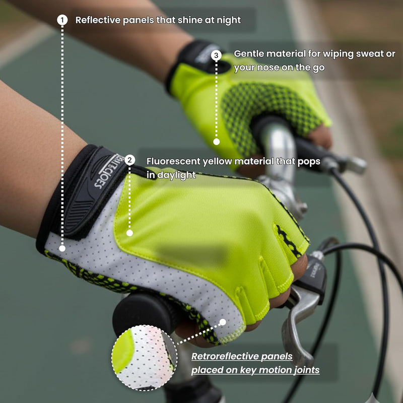 Neon yellow half-finger cycling gloves held on bike handlebars at night showing reflective wrist strips