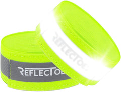 Two neon yellow ReflecToes reflective safety bands with silver retroreflective strip on white