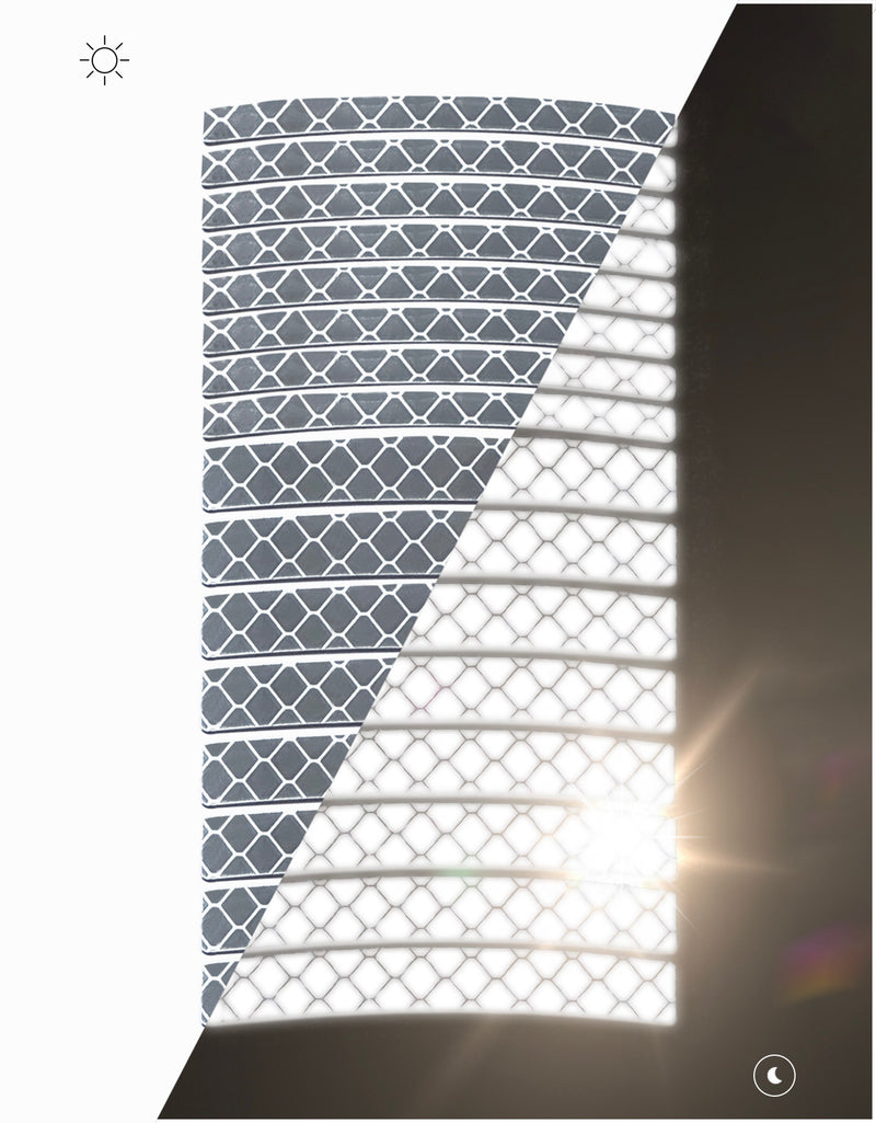 Sheet of silver ReflecToes reflective rim decal strips day and night split showing brightness