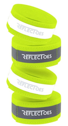Four neon yellow ReflecToes reflective safety bands stacked on white background