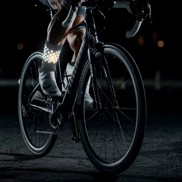 Cyclist wearing reflective socks