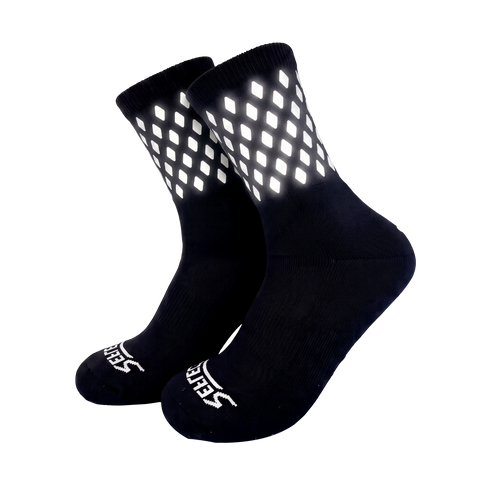 ReflecToes reflective socks with the reflective diamonds lit up